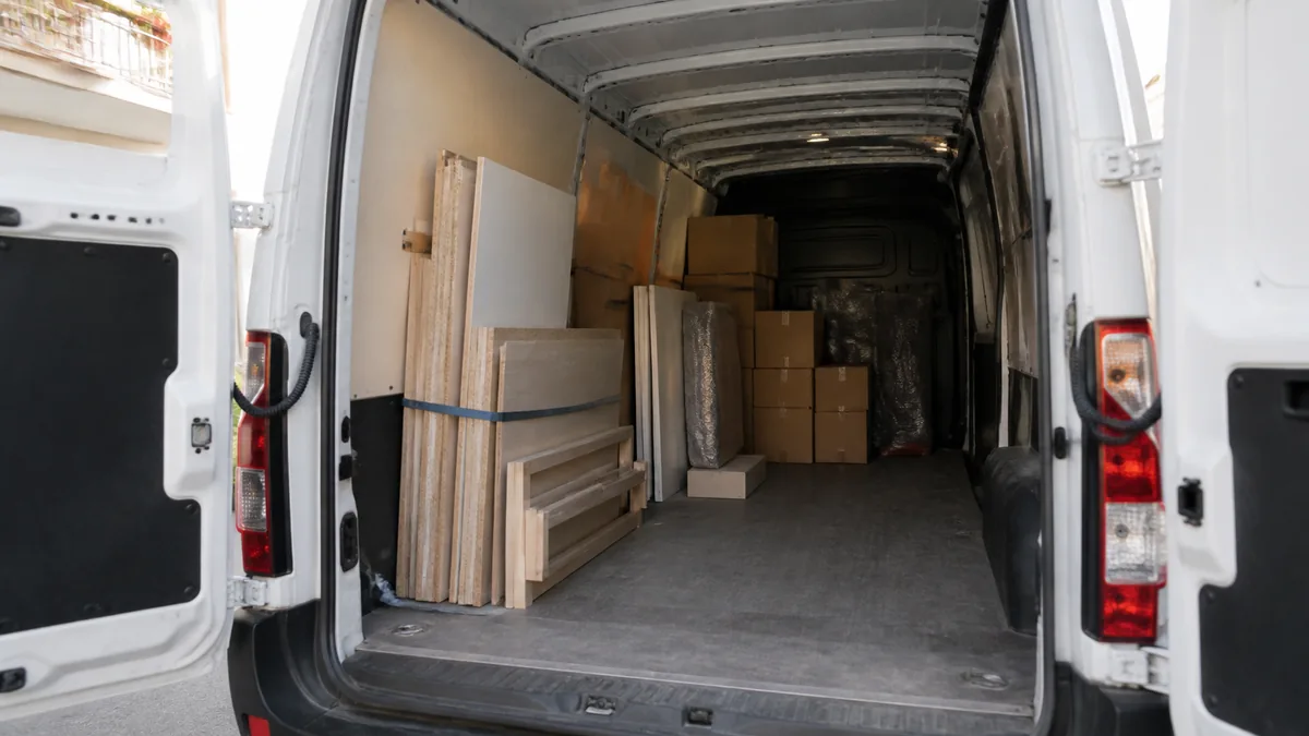 An open van loaded halfway — how many vans a three-bedroom flat needs